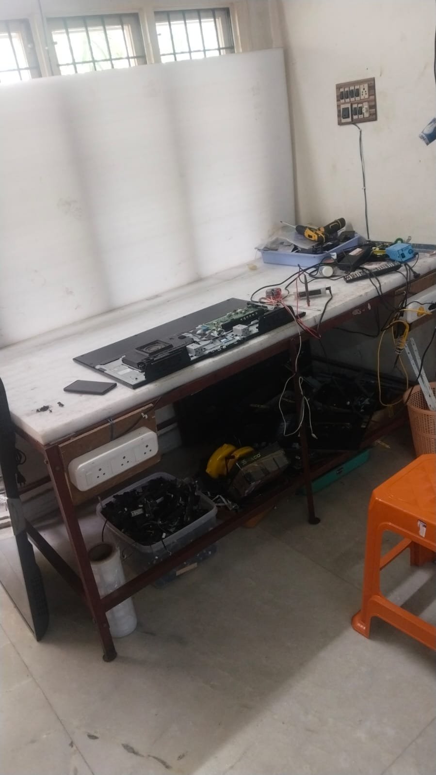 TV Restarting Automatically — television being checked by a repair technician